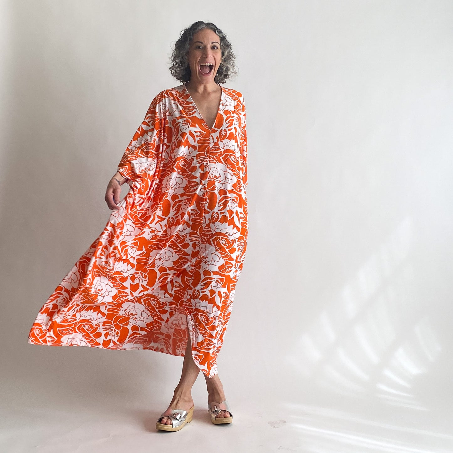 House of Lu Diana Caftan in Color Number 47. Orange and White vintage floral print in a vintage acetate fabric. Featured here in size Original.