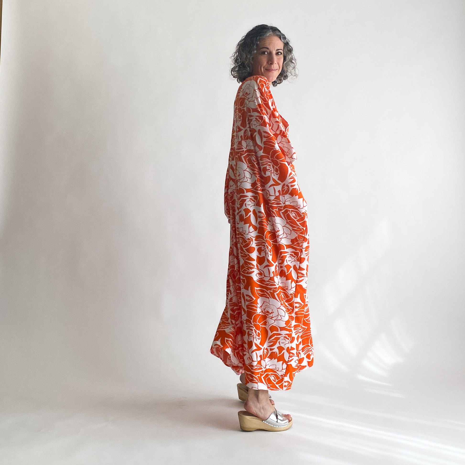 House of Lu Diana Caftan in Color Number 47. Orange and White vintage floral print in a vintage acetate fabric. Featured here in size Original. 
