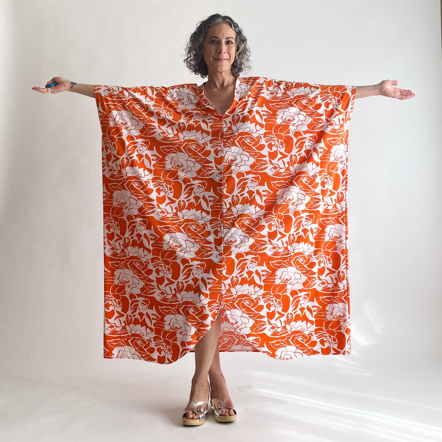 House of Lu Diana Caftan in Color Number 47. Orange and White vintage floral print in a vintage acetate fabric. Featured here in size Original. 