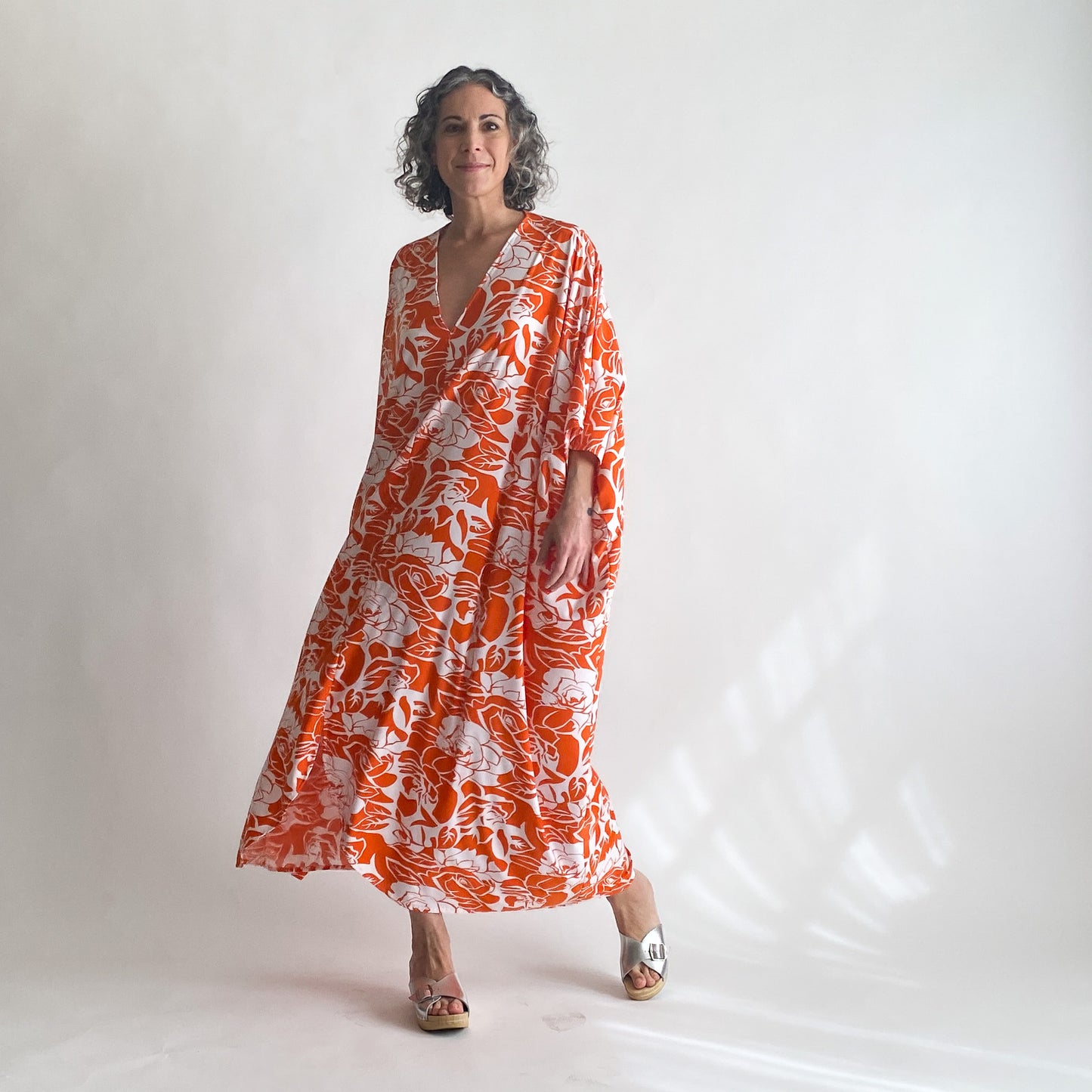 House of Lu Diana Caftan in Color Number 47. Orange and White vintage floral print in a vintage acetate fabric. Featured here in size Original. 