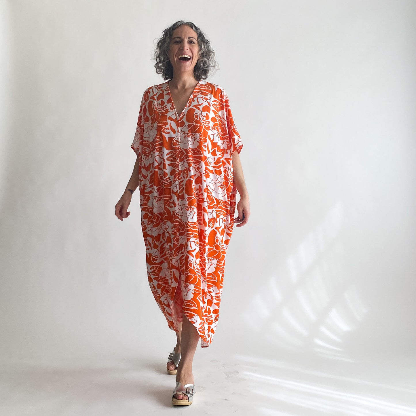 House of Lu Diana Caftan in Color Number 47. Orange and White vintage floral print in a vintage acetate fabric. Featured here in size Petite.