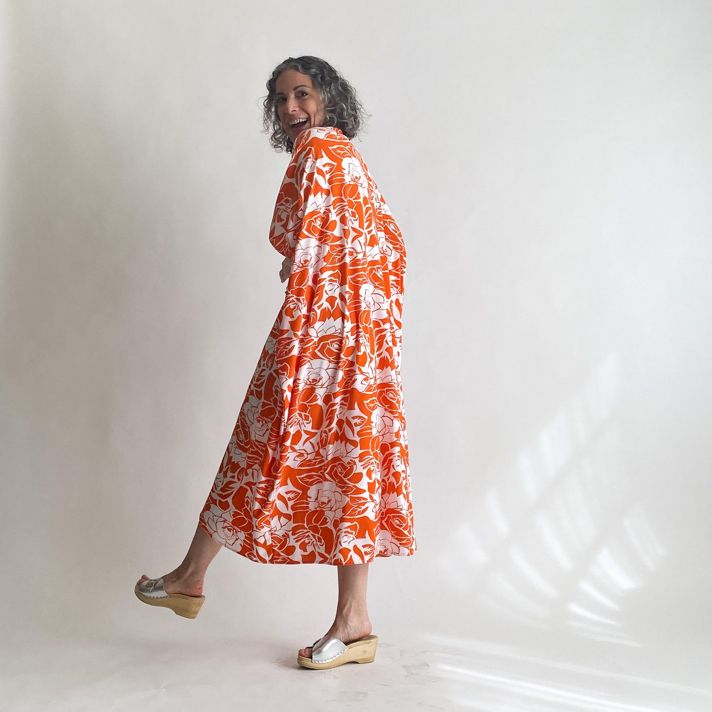 House of Lu Diana Caftan in Color Number 47. Orange and White vintage floral print in a vintage acetate fabric. Featured here in size Petite.