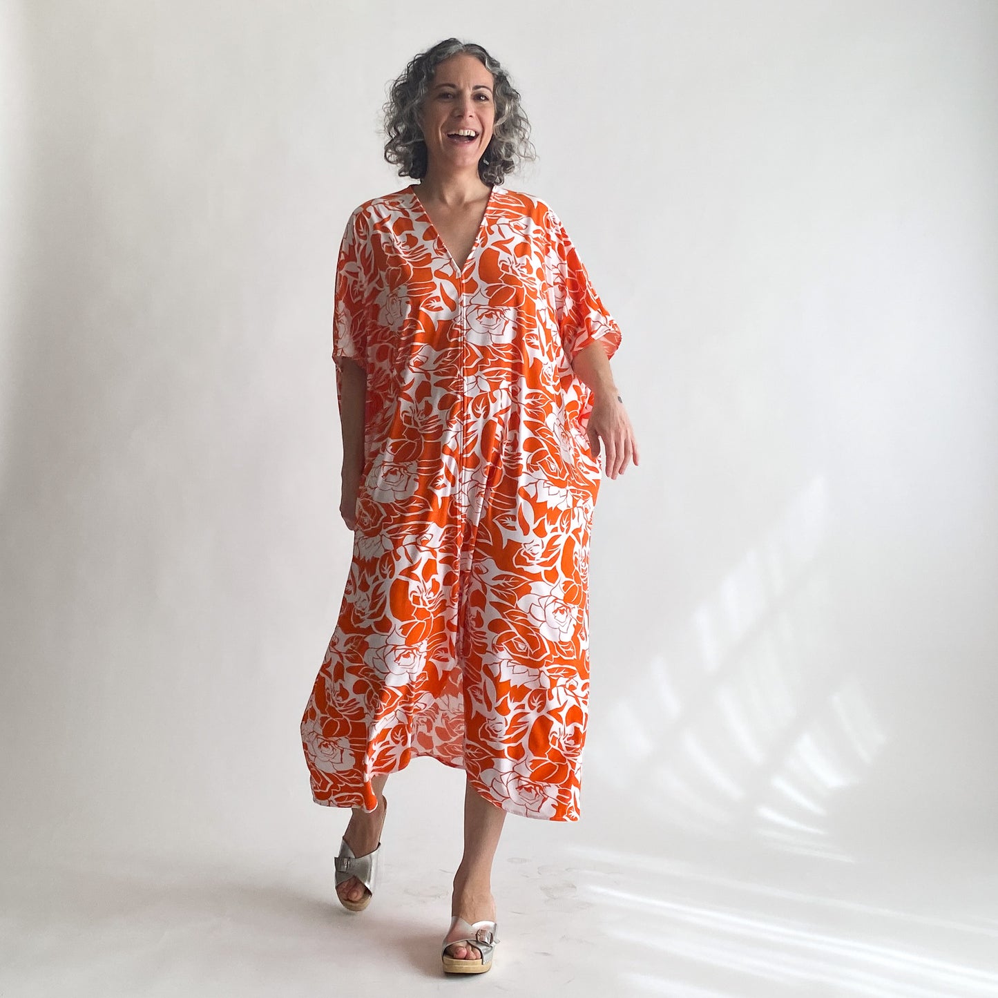 House of Lu Diana Caftan in Color Number 47. Orange and White vintage floral print in a vintage acetate fabric. Featured here in size Petite.