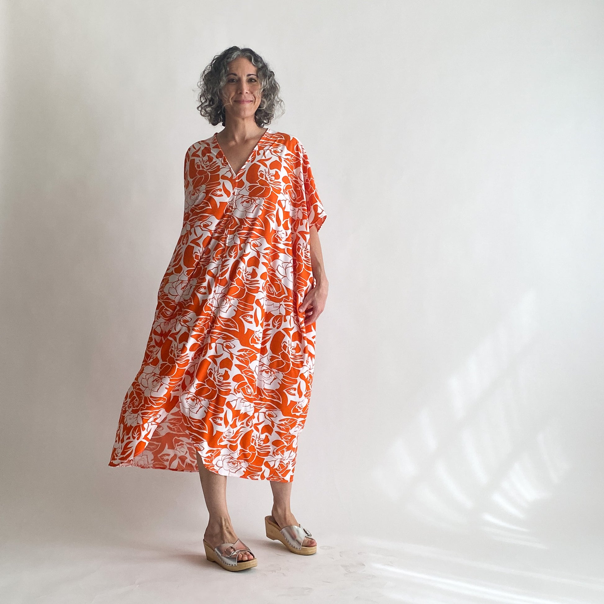 House of Lu Diana Caftan in Color Number 47. Orange and White vintage floral print in a vintage acetate fabric. Featured here in size Petite.
