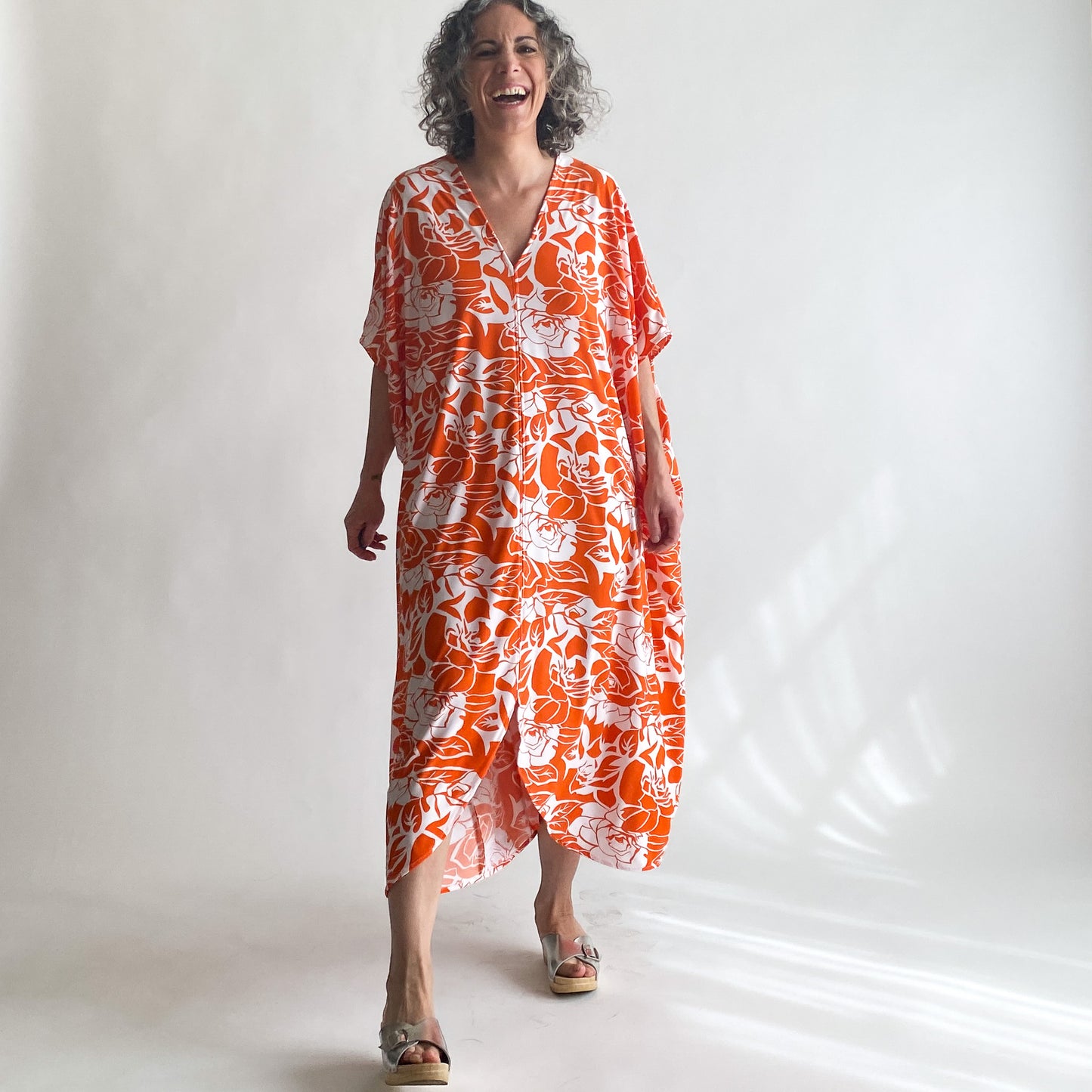 House of Lu Diana Caftan in Color Number 47. Orange and White vintage floral print in a vintage acetate fabric. Featured here in size Petite.