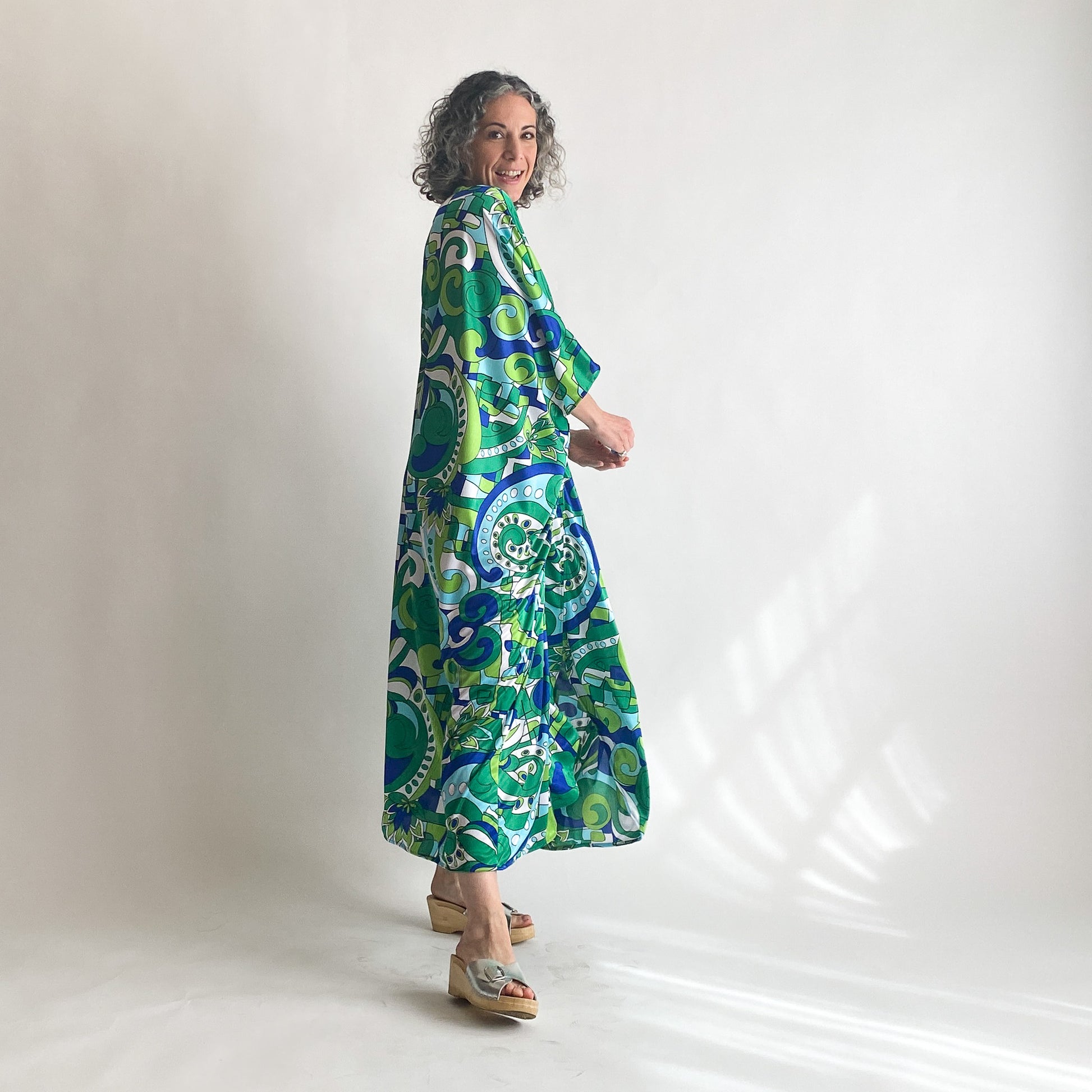 House of Lu Diana Caftan in Color Number 46. A vintage psychedelic blue and green print made of vintage acetate fabric. Perfectly draped and perfectly packable. Only five available. 