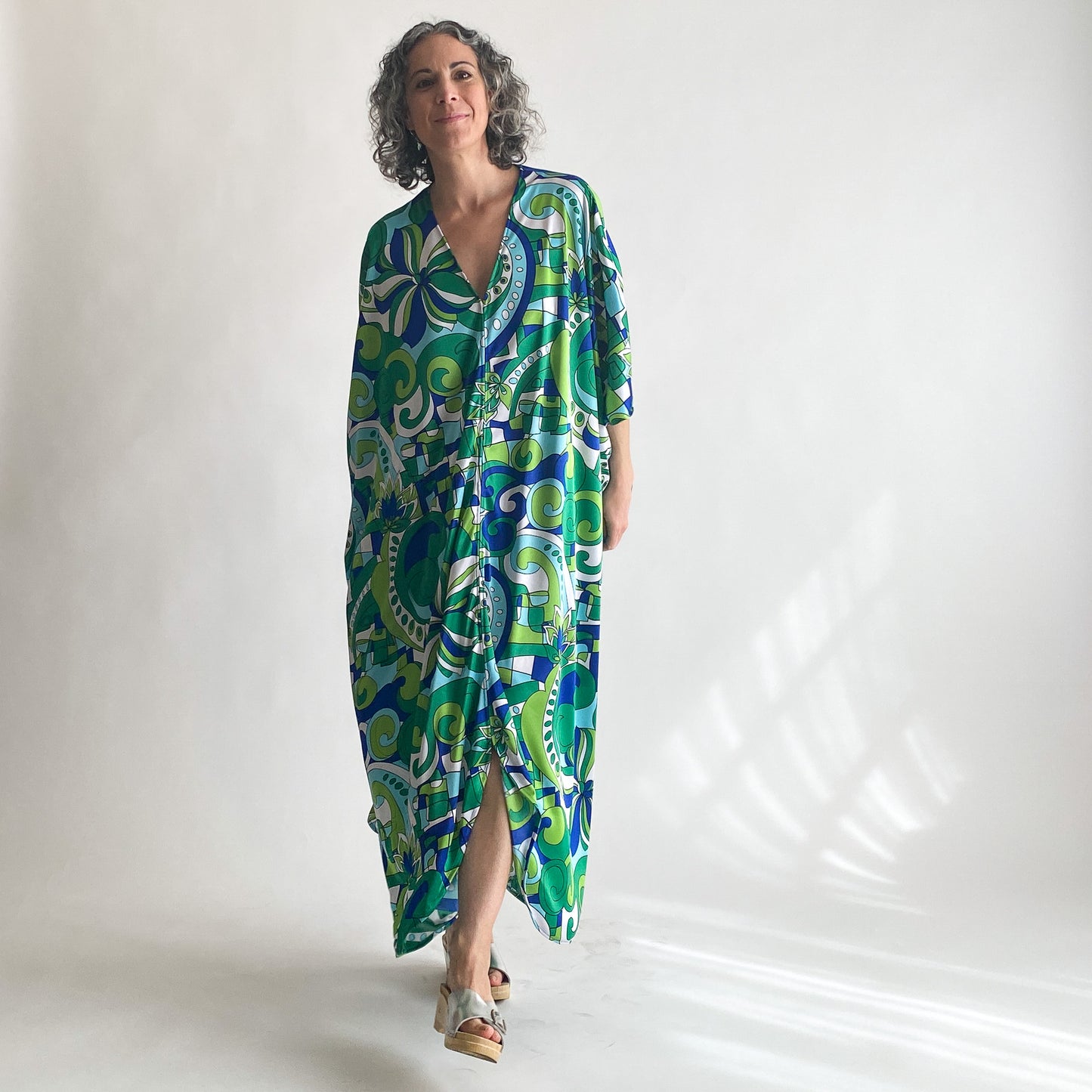House of Lu Diana Caftan in Color Number 46. A vintage psychedelic blue and green print made of vintage acetate fabric. Perfectly draped and perfectly packable. Only five available. 