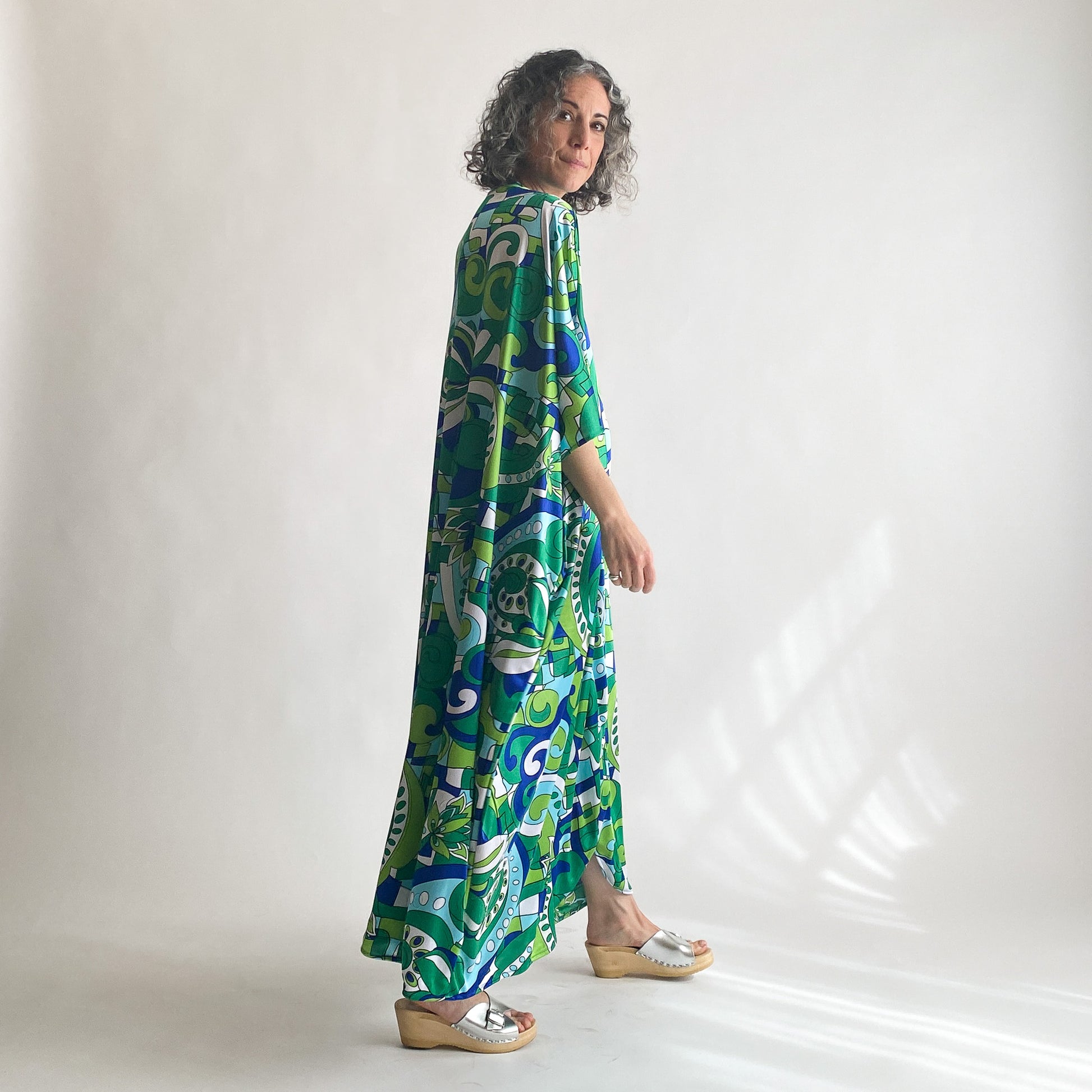 House of Lu Diana Caftan in Color Number 46. A vintage psychedelic blue and green print made of vintage acetate fabric. Perfectly draped and perfectly packable. Only five available. 