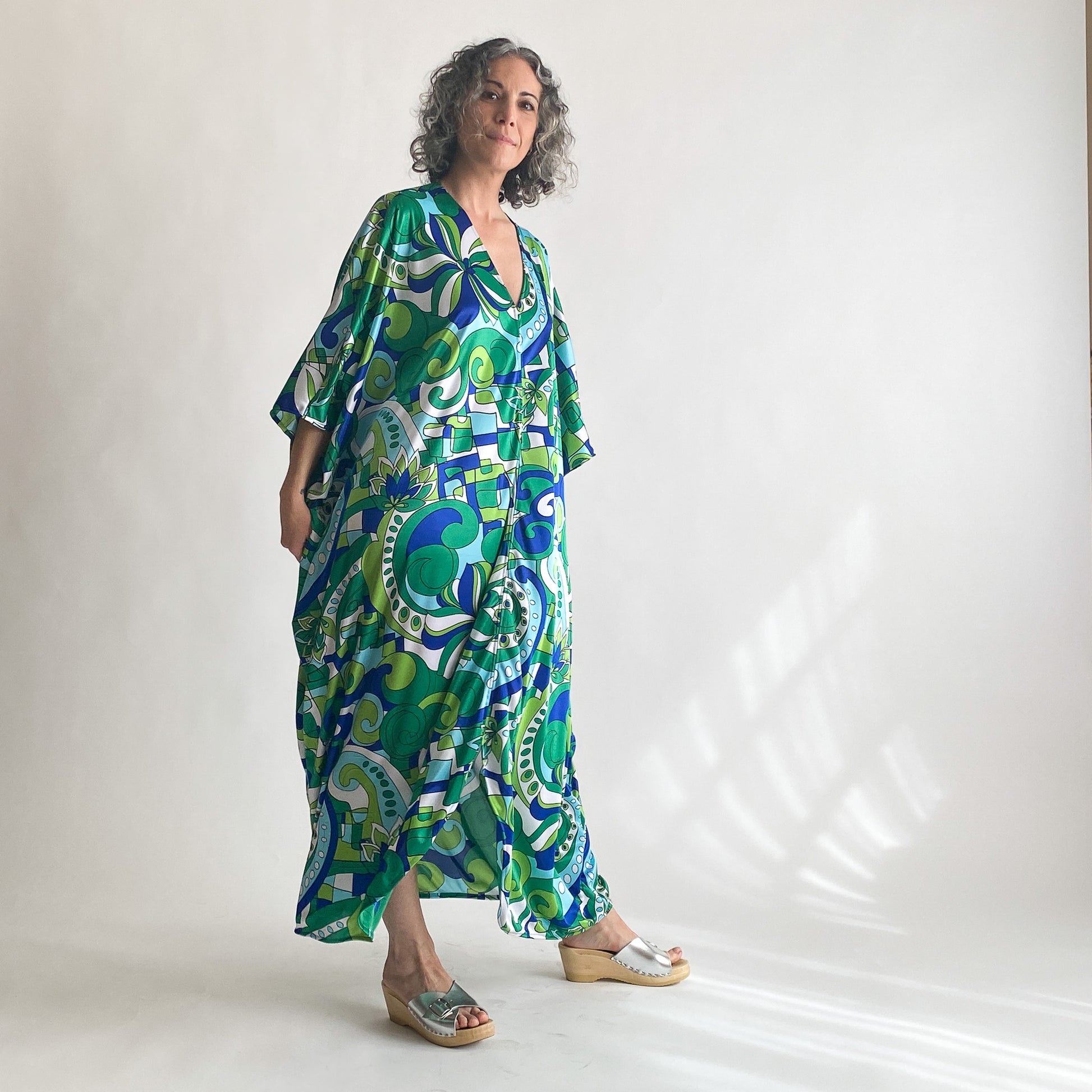 House of Lu Diana Caftan in Color Number 46. A vintage psychedelic blue and green print made of vintage acetate fabric. Perfectly draped and perfectly packable. Only five available. 